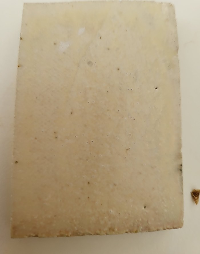 A test tile glazed overall in Gen’s Satin Matte — an even, soft cream surface with no gloss