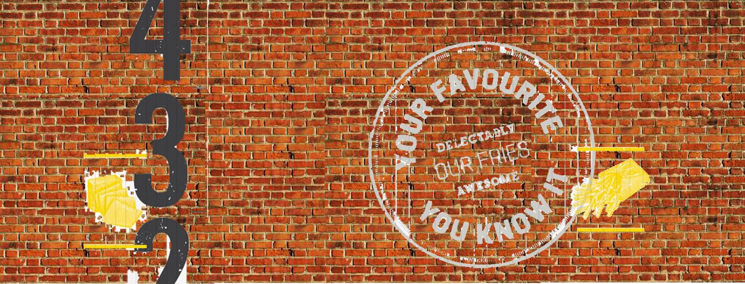The existing red brick wall with sign-written graphics &mdash; large black numerals running down one side, yellow fry motifs and a white circular stamp reading Your Favourite, You Know It